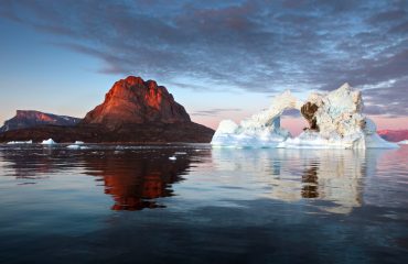 Beautiful landscape with large icebergs in the middle of the sea